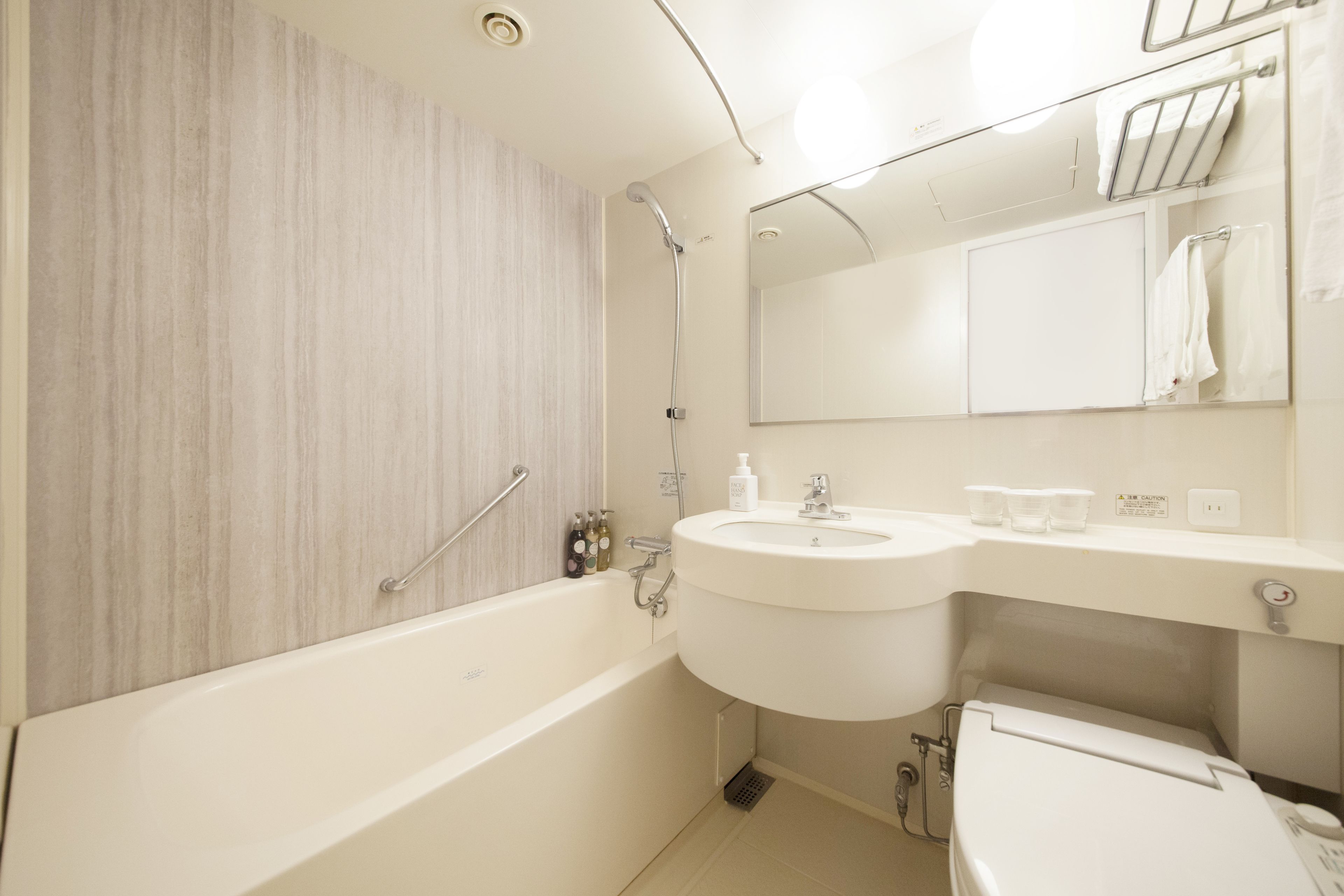 combined shower/bathtub, free toiletries, hair dryer, slippers