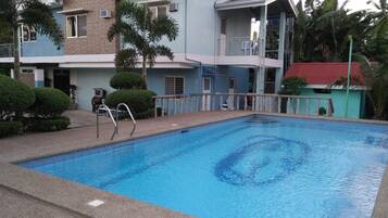 Outdoor pool, open 6 AM to 10 PM, pool umbrellas, sun loungers