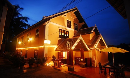 Front of property - evening/night. Merry Riverside Hotel