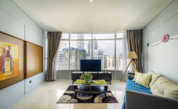 Apartment, 3 Bedrooms | Living room | Flat-screen TV