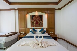 Triple Family Room | Minibar, in-room safe, desk, free WiFi