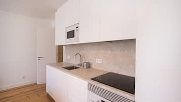 Departamento, 2 habitaciones, para fumadores, 2 baños | Cocineta privada | Refrigerador, microondas, horno y parrilla de estufa
