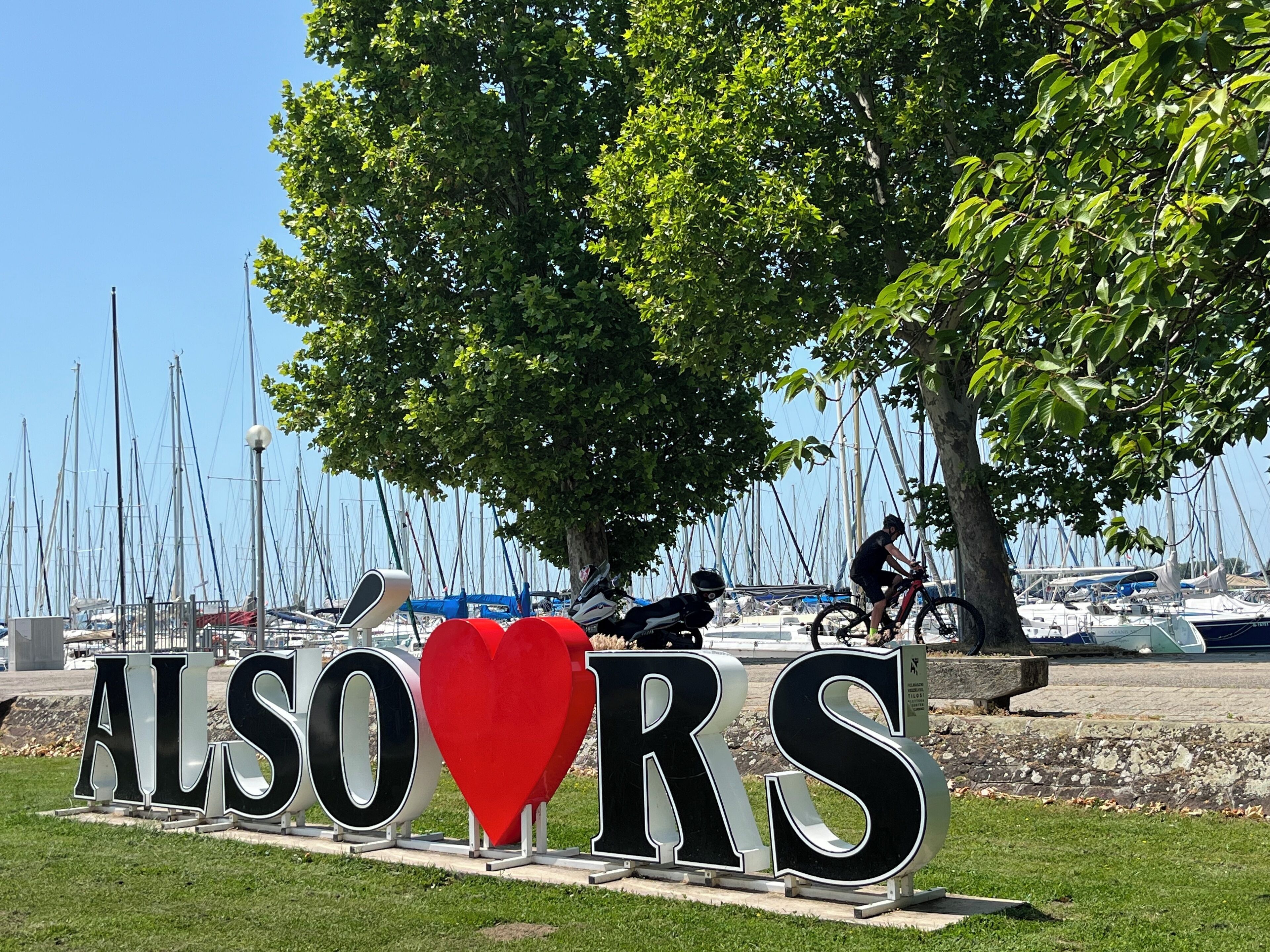 A sign with the text "ALSO R'S" and a red heart symbol.