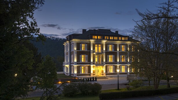 A large, multi-story building with a symmetrical facade, multiple windows, and a well-maintained lawn. - Park Hotel & Spa Katharina (Badenweiler)