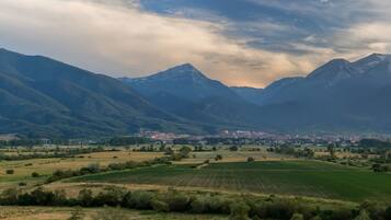 A mountainous landscape with a town in the valley.