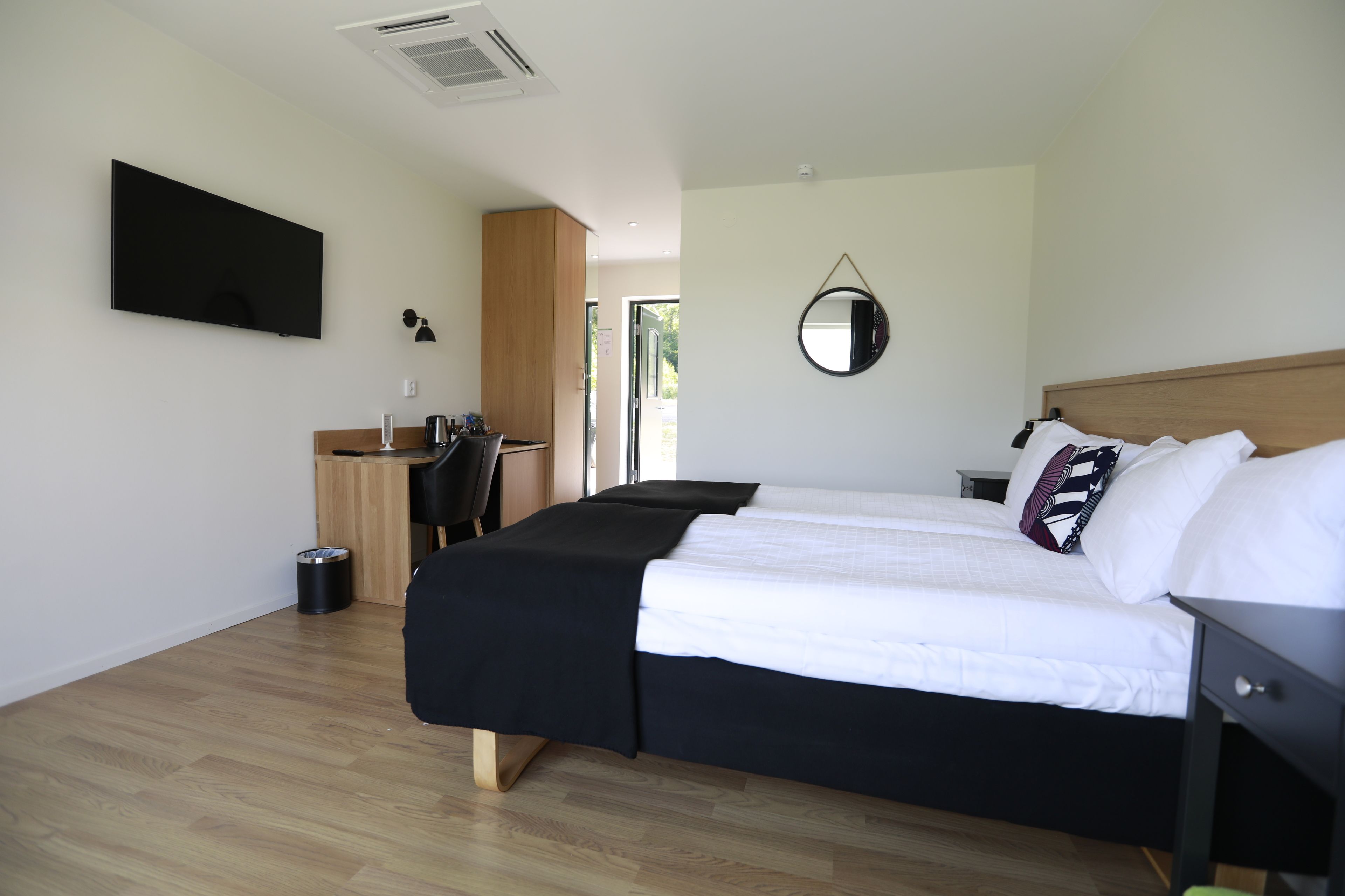 premium double room, 2 single beds, golf view | living area | led tv