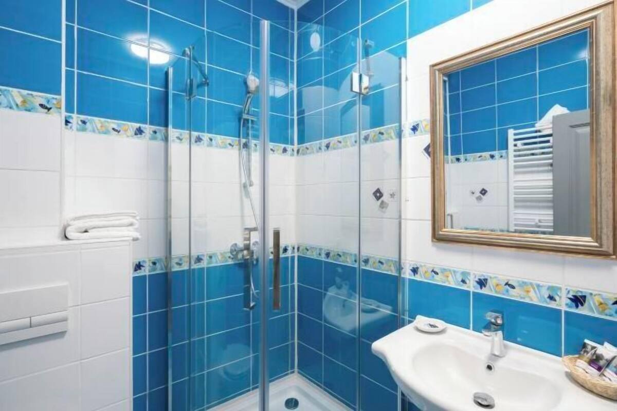 Bathroom | Shower, eco-friendly toiletries, hair dryer, towels