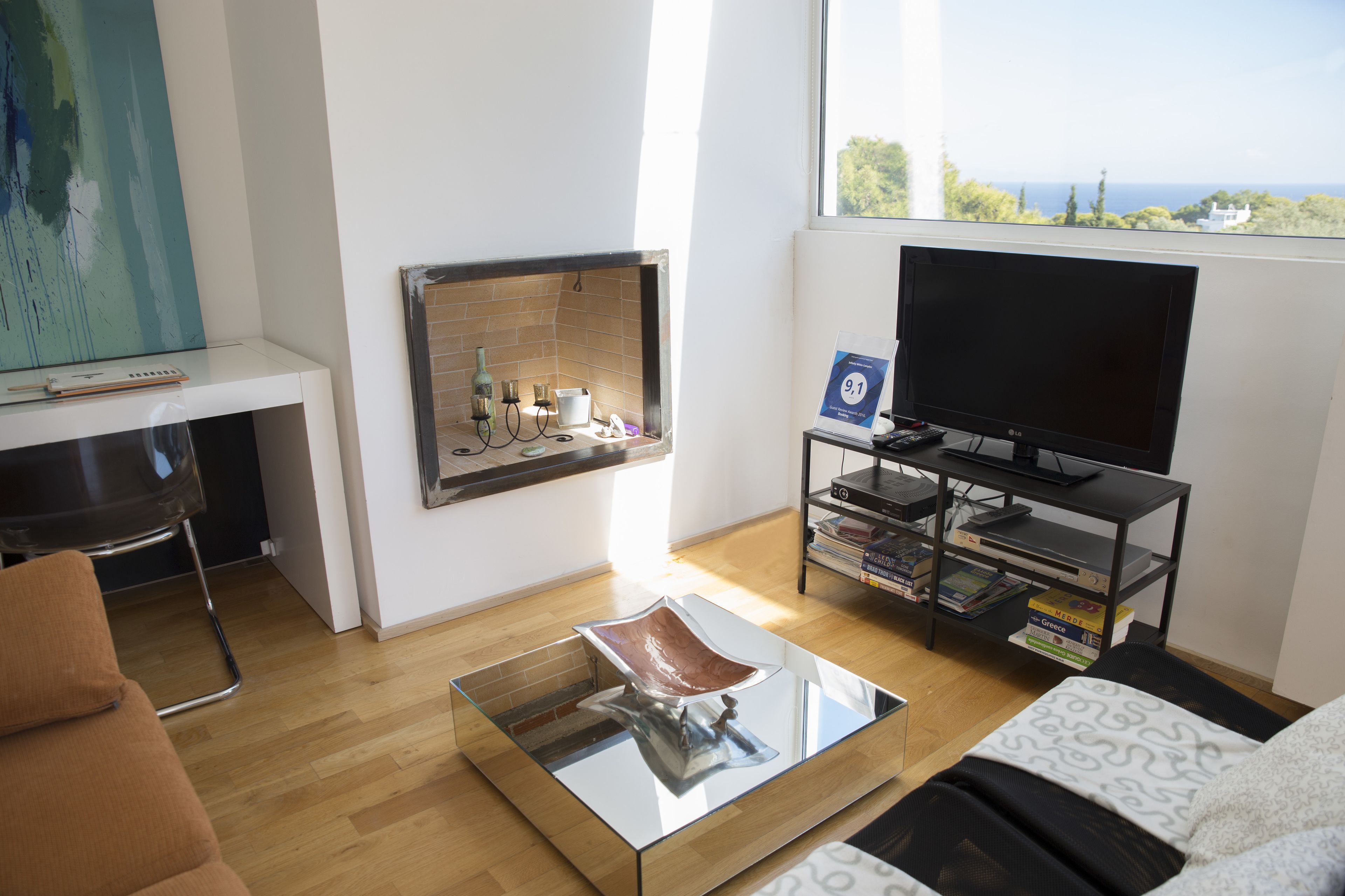 Deluxe Apartment, Partial Sea View | Living room | Flat-screen TV