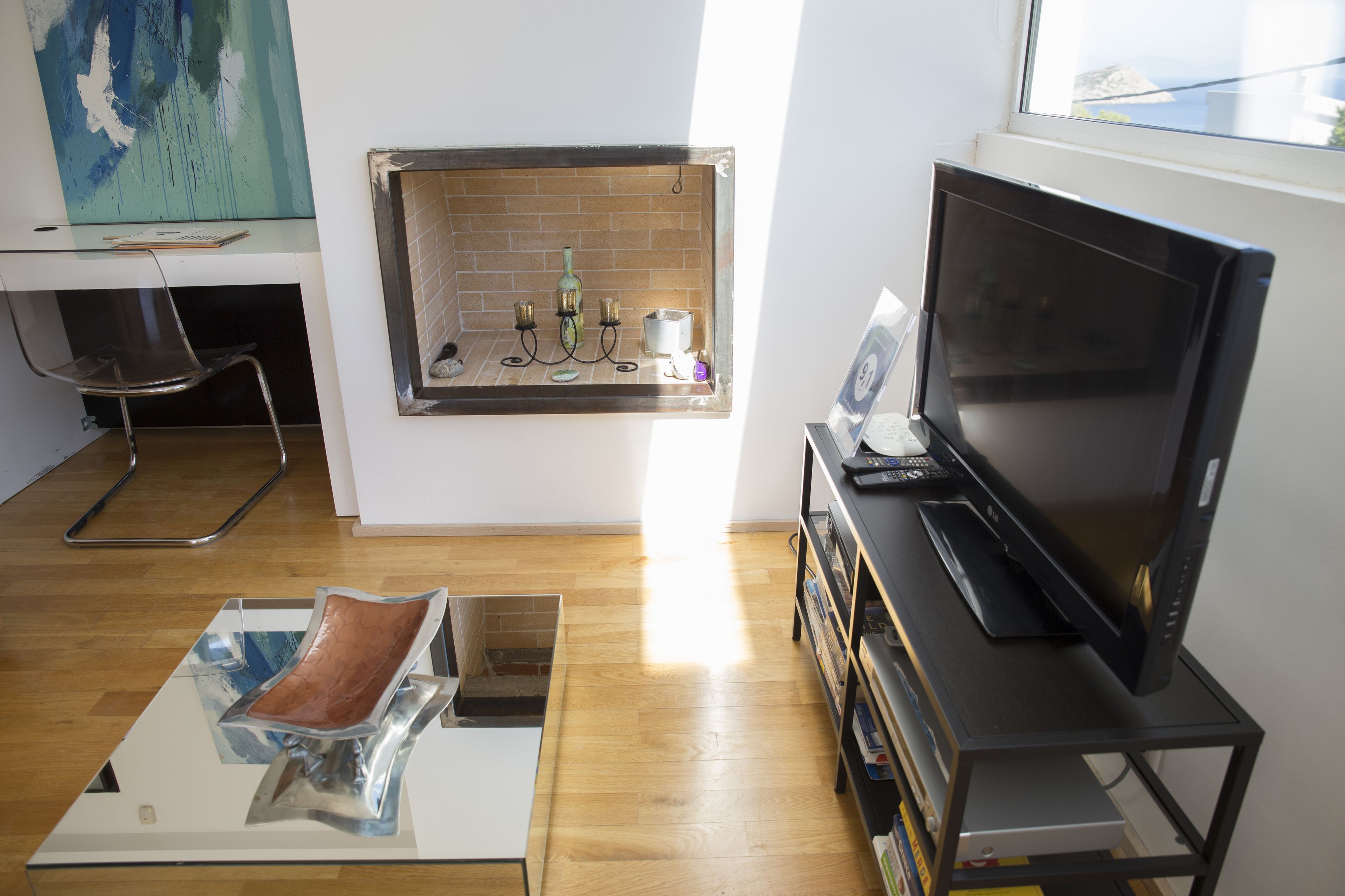 deluxe apartment, partial sea view | living area | flat-screen tv