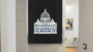 A hallway with a black and white patterned floor, a framed artwork of a building, and a door on the left. - Mascherino Suites (Rome)