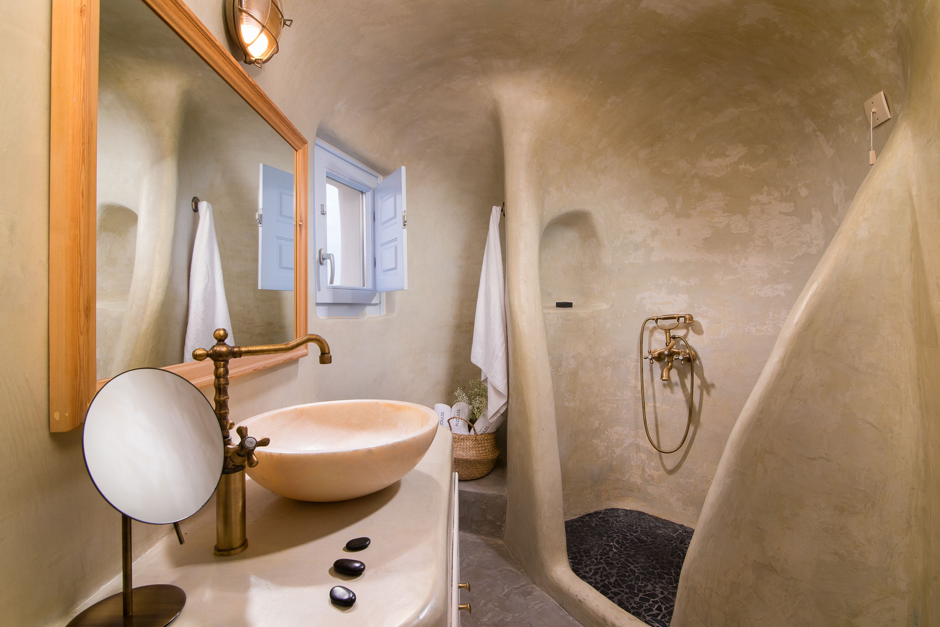 ligaria cave suite with caldera view | bathroom | shower, free toiletries, hair dryer, bathrobes