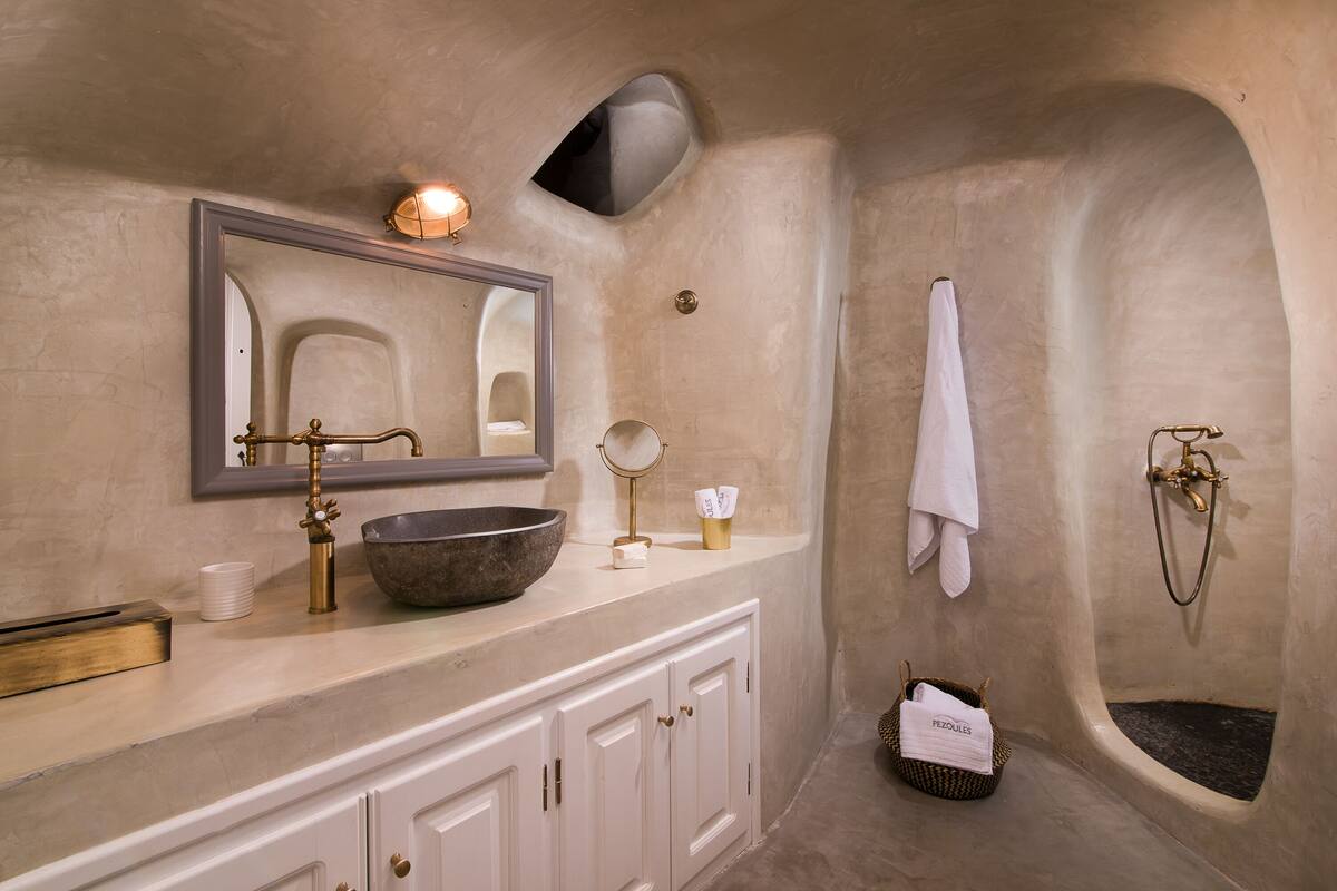 louisa cave suite with caldera view | bathroom | shower, free toiletries, hair dryer, bathrobes
