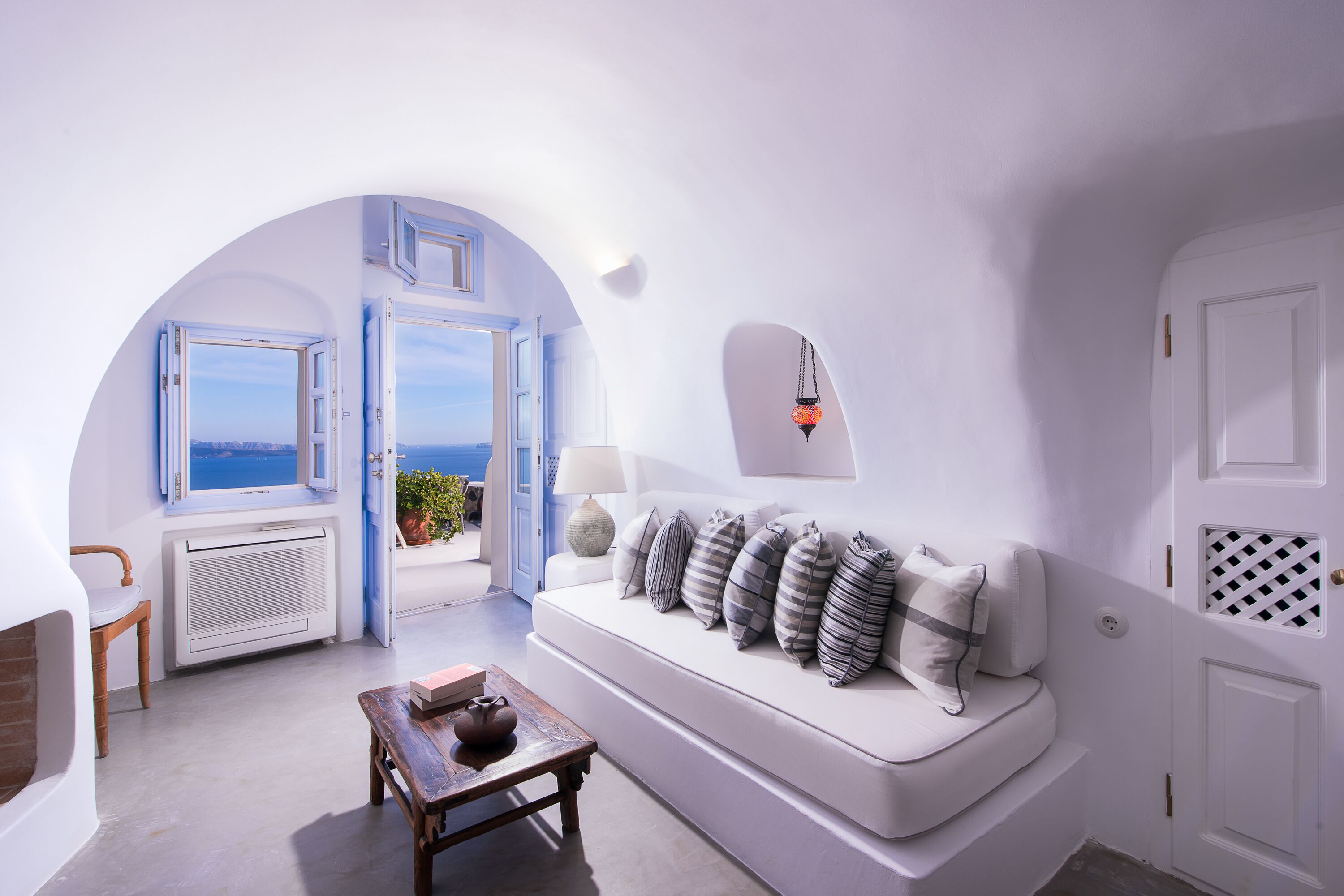 ligaria cave suite with caldera view | living area | 32-inch lcd tv with satellite channels, tv