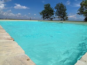 Outdoor pool, pool umbrellas, sun loungers