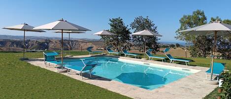 Outdoor pool, pool umbrellas, pool loungers