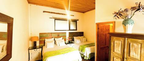 A bedroom with two beds, wooden headboards, a wooden ceiling, a nightstand with a lamp, and a cabinet.