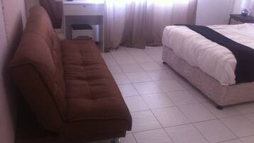 Double Room, Garden View | Living area | TV