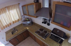 Full-sized fridge, microwave, stovetop, coffee/tea maker