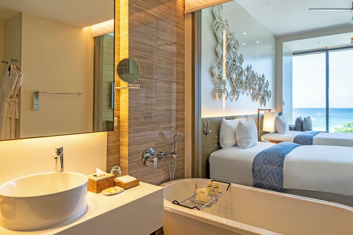 deluxe seaview | bathroom | separate bathtub and shower, free toiletries, hair dryer, bathrobes