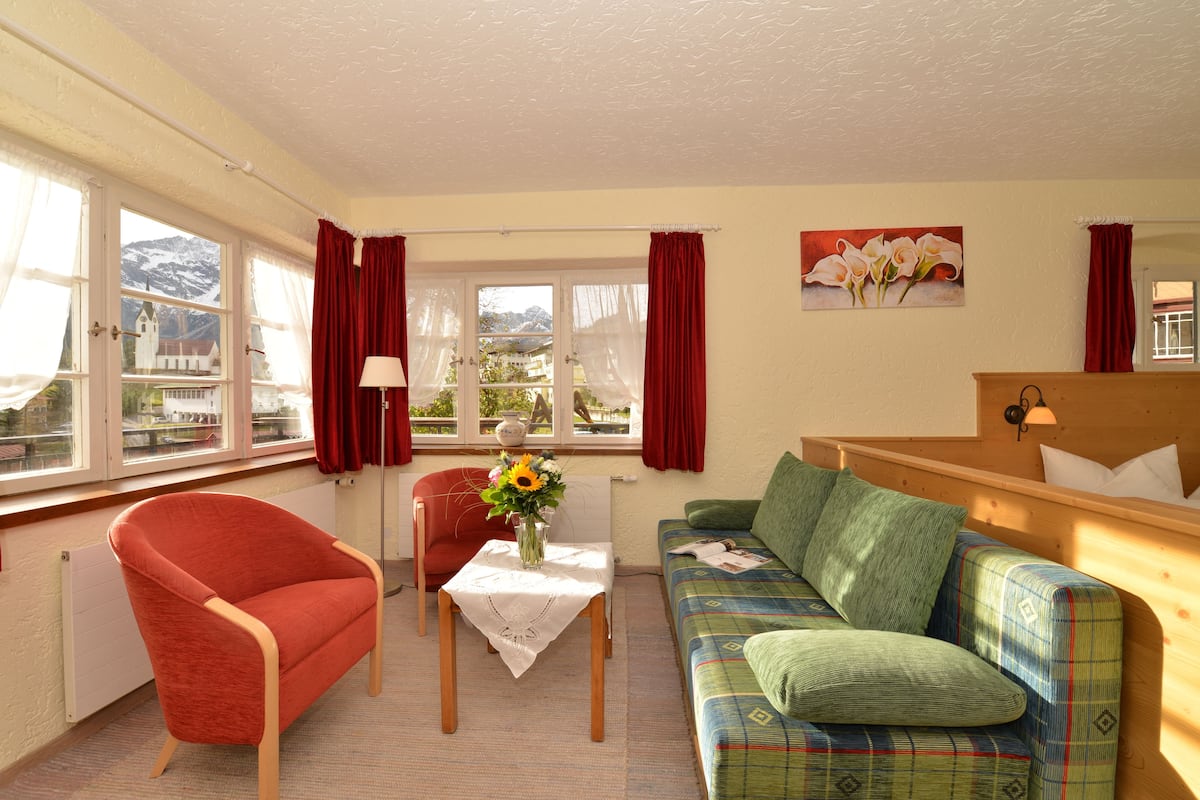 superior double room, balcony, annex building | living area | tv