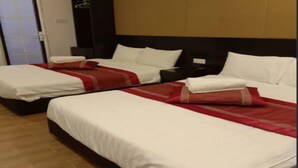 A hotel room with two beds, each with white bedding and red accents. There is a wardrobe and a nightstand with a lamp. - Hotel O Dspark Port Klang (Pelabuhan Klang)