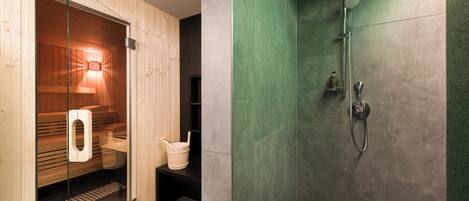 A modern bathroom with a sauna, a glass-enclosed shower area, and a wooden bench.