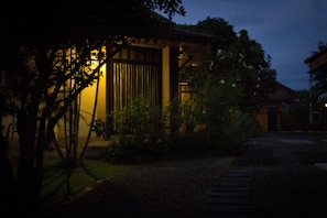 Traditional Japanese-style building with a tiled roof and well-maintained garden.