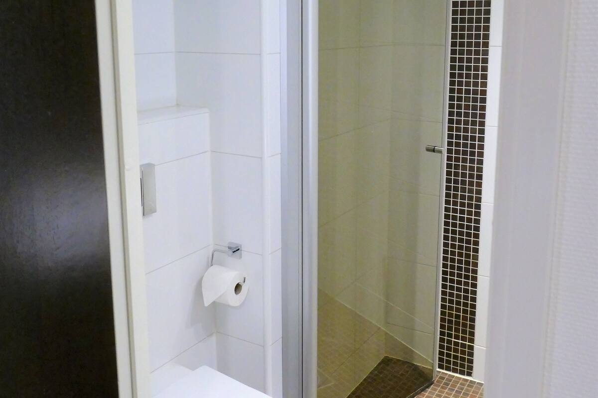 shower, hair dryer, bidet, towels