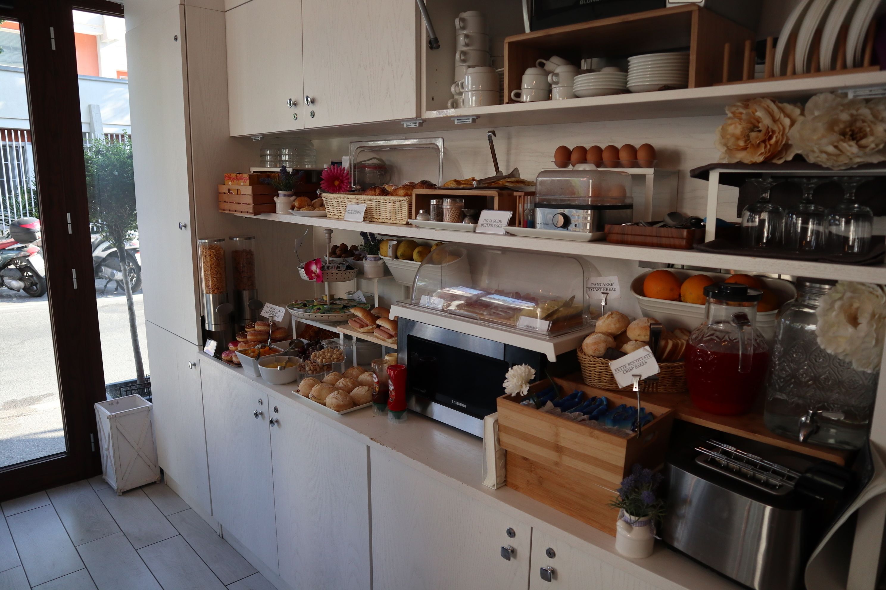 A breakfast buffet with various food items and beverages.