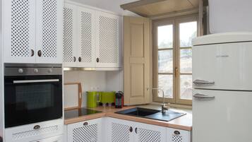 Villa, 2 Bedrooms, Sea View | Private kitchen | Full-sized fridge, oven, stovetop, coffee/tea maker