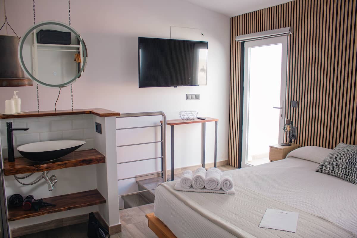 Appartement Penthouse Deluxe, 1 chambre, vue sur la ville | 1 chambre, literie de qualitĂ©, systĂšme dâinsonorisation