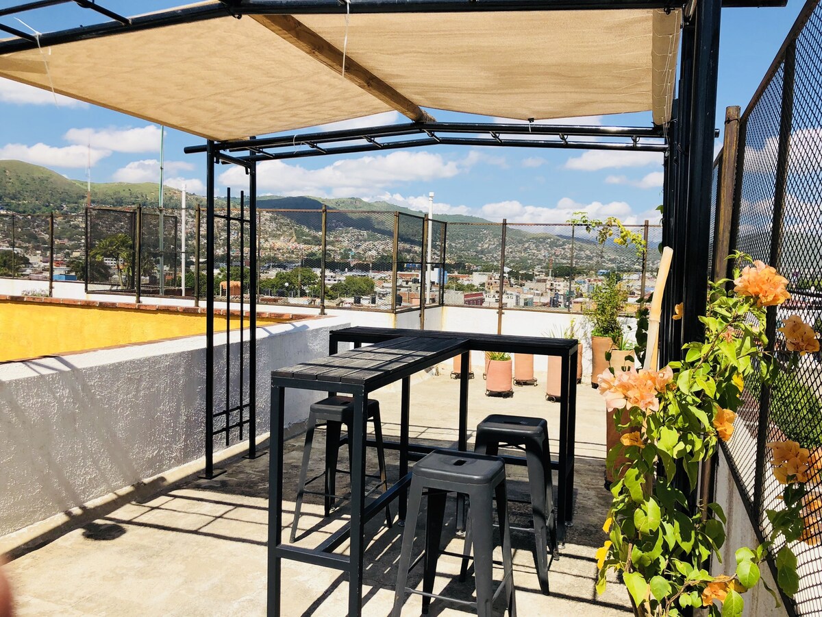 tables in the sunroof of Andaina Youth Hostel where you can have your meals