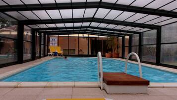 Indoor pool, open 10:00 AM to 8:00 PM, pool loungers