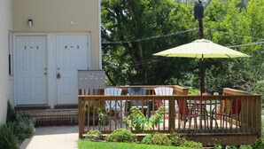 A residential deck with outdoor furniture and a mailbox. - Apartment In Downtown Durham (Durham)