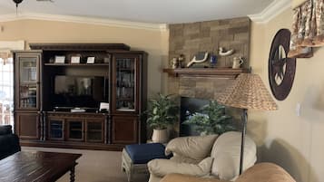 Smart TV, fireplace, DVD player, books