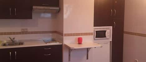 Fridge, microwave, stovetop, coffee/tea maker