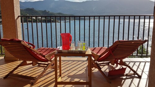 House feet in water, comfort and relaxation, sandy beach in front of house