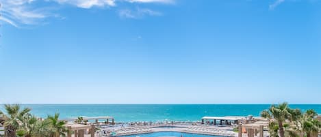 On the beach, sun-loungers, beach towels