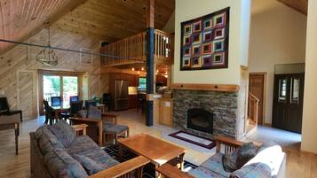 TV connectée, cheminée, lecteur de DVD, table de tennis de table