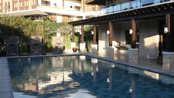 Outdoor pool, open 7 AM to 7 PM, pool umbrellas, pool loungers