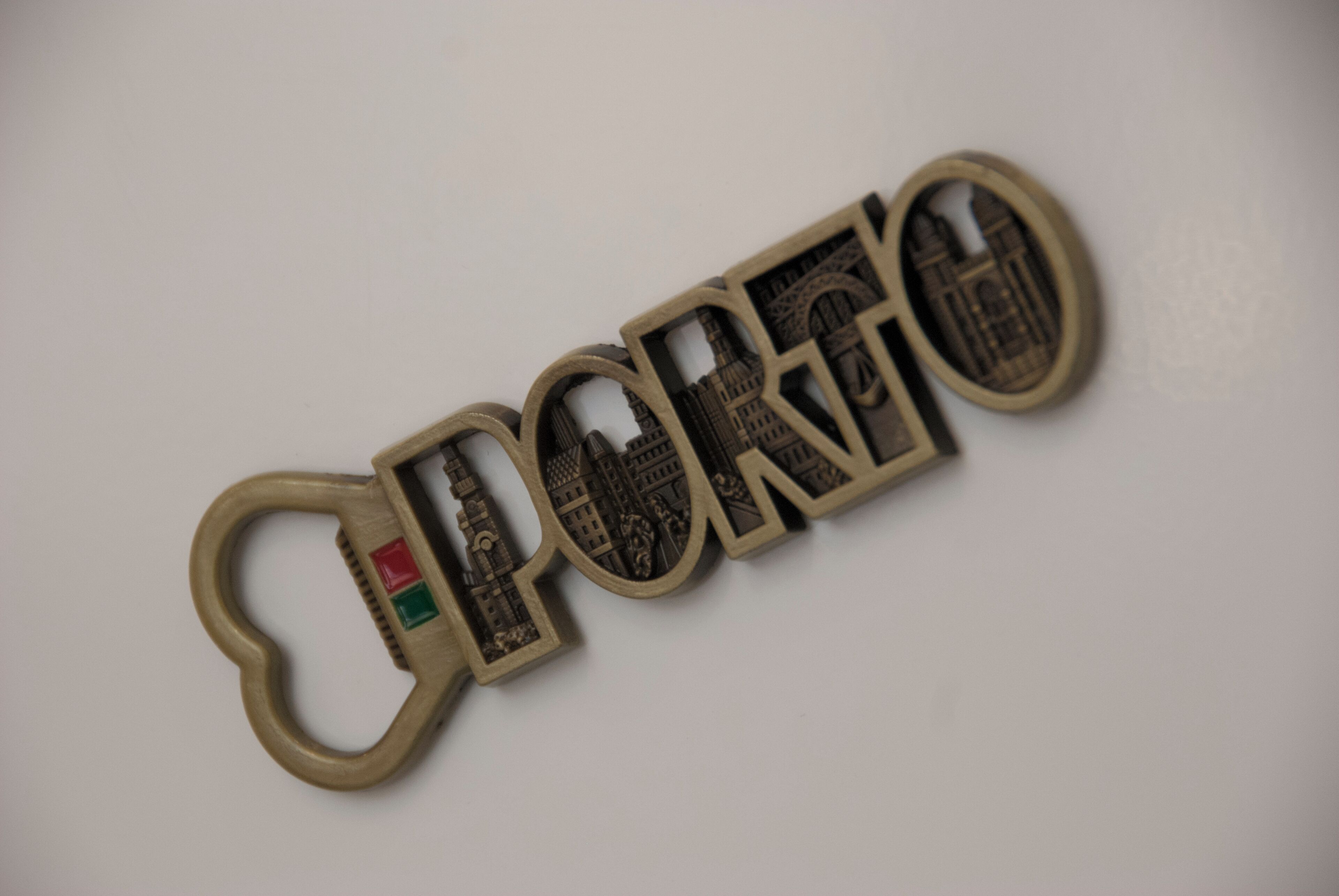 A keychain with the word 'PORGO' and a cityscape design.