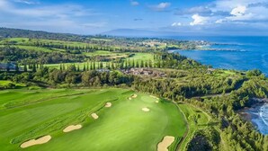 A golf course with bunkers, a clubhouse, and a coastal view. - #1 GUEST FAVORITE for Napili & Kapalua Bays ! (Lahaina)
