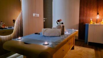 A modern bedroom with a wooden bed, a small bedside table, and a nightstand.