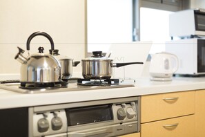 Fridge, microwave, electric kettle, cookware/dishes/utensils