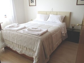 1 bedroom, desk, iron/ironing board, travel crib