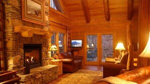 Smart TV, chimenea, reproductor de DVD y futbolito