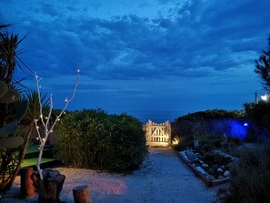 Stroll through lush gardens to a traditional entrance.