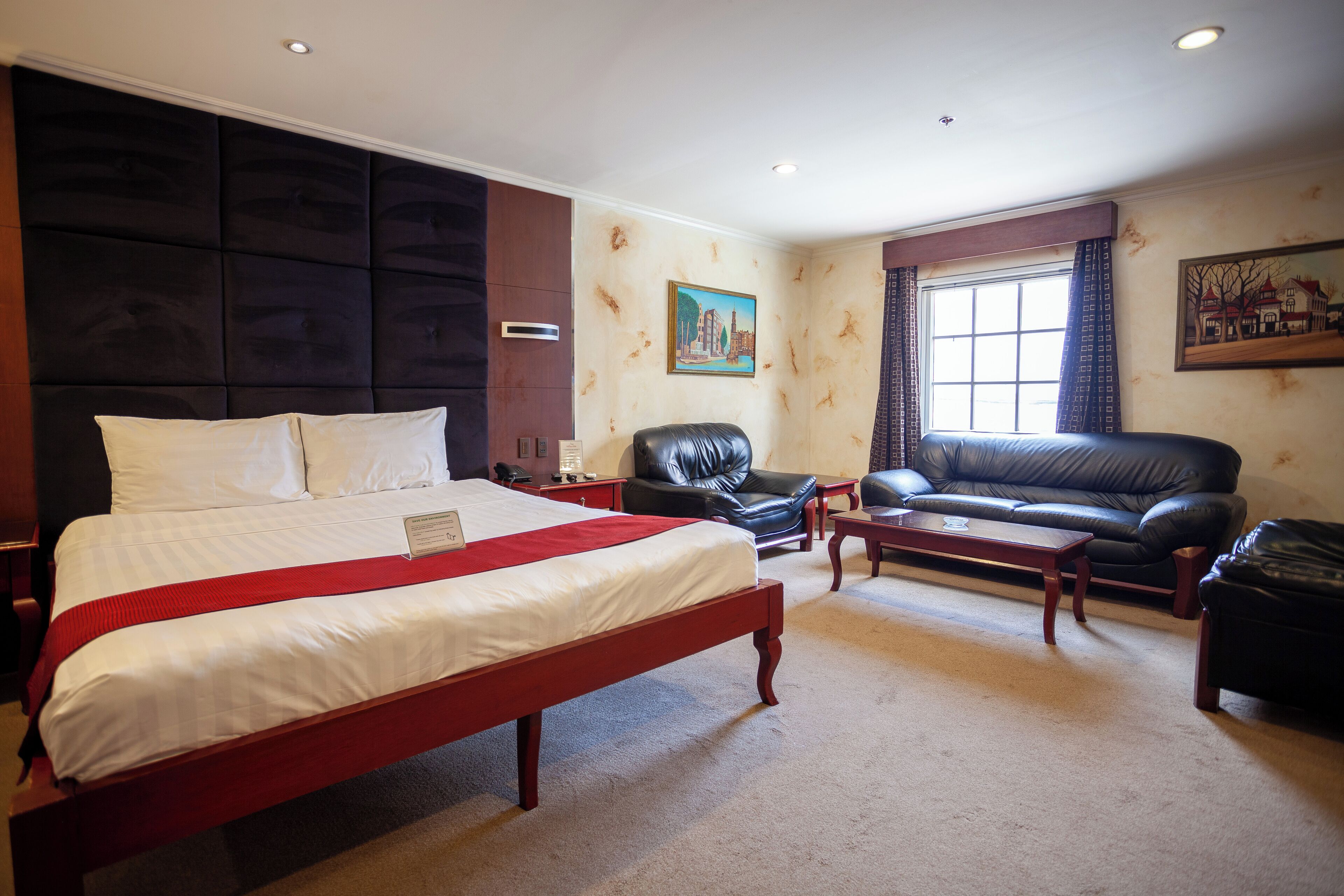 deluxe room | minibar, in-room safe, desk, laptop workspace