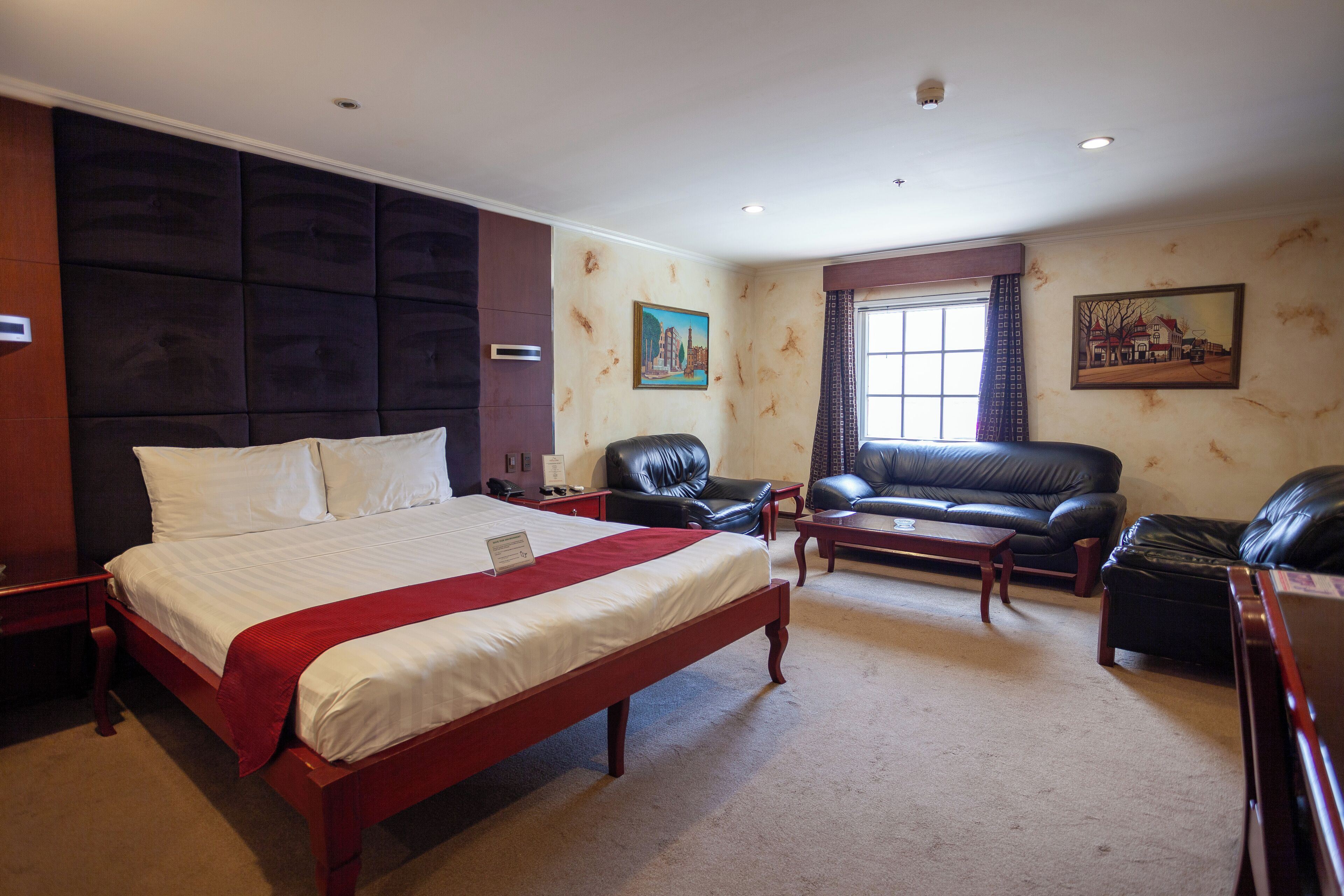 deluxe room | minibar, in-room safe, desk, laptop workspace