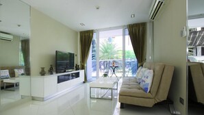 1 Bedroom Apartment | Living room | 42-inch flat-screen TV with cable channels, TV - Cozy Apartment (Pattaya)